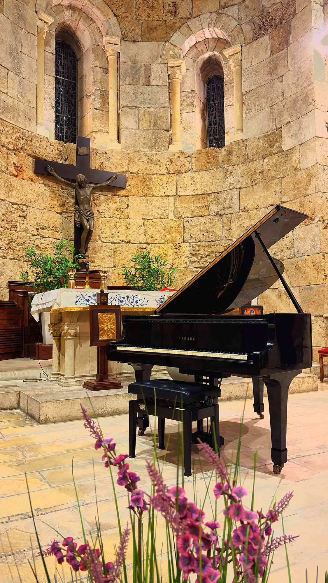 A Yamaha grand piano at the altar of Saint Jean Marc church for a concert