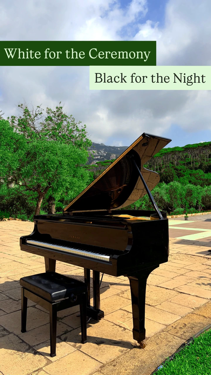 A black grand piano outdoors for an evening event, Basbous & Sons rentals