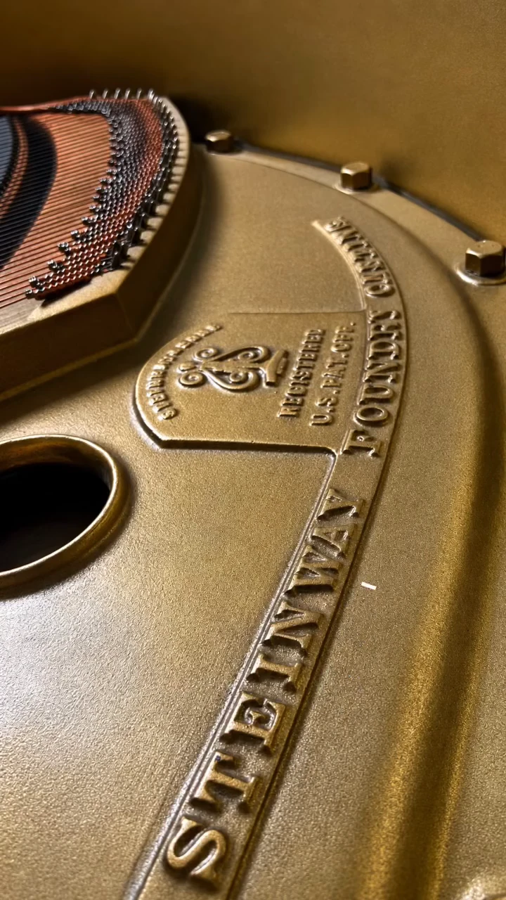 The gilded Steinway & Sons plate inside the Golden Steinway